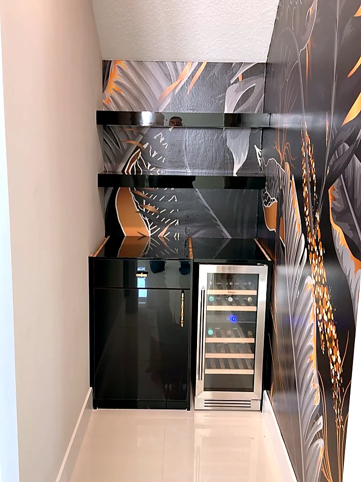 Dramatic dark botanical mural installed in a butler pantry